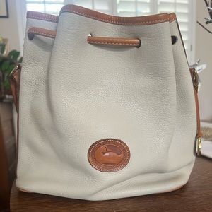 Cream and brown Dooney & Bourke purse